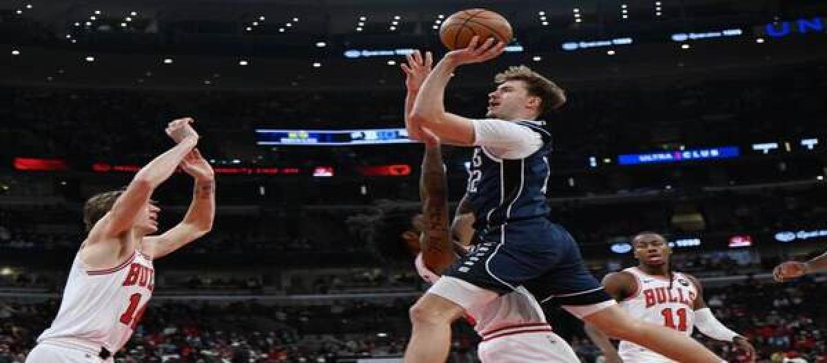 With White scoring 22 points and Dossam adding 20, the Bulls easily defeated the Mavericks 125-107.