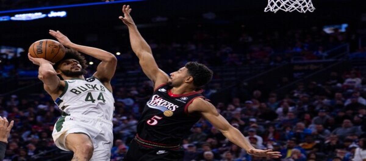 Maxi scored 21 points and Grimes added 20, as the 76ers defeated the Bucks 126-106.