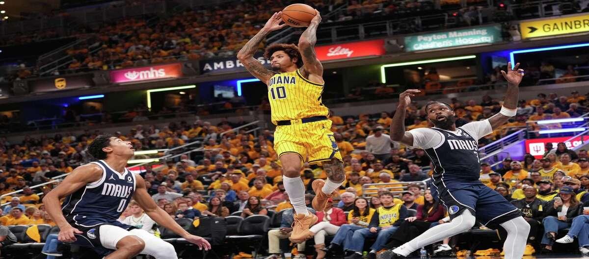 Kyrie Irving scored 24 points and Washington added 20, as the Mavericks defeated the Pacers 121-105.